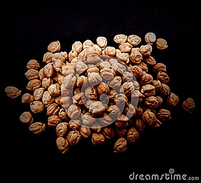 Chickpeas on black background TheÂ chickpeaÂ or chick pea (Cicer arietinum) is an annual legume of the family Fabacea Stock Photo